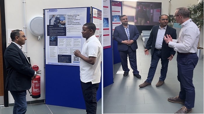 People ho9lding a discussion around a student poster presentation