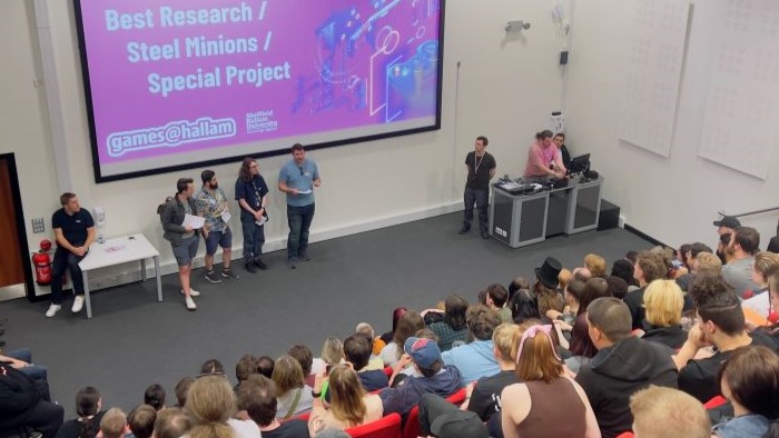 Lecture theatre full of participants during a presentation of awards