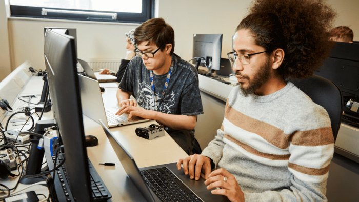 Two people working at computers