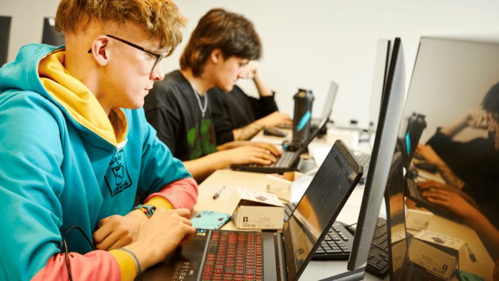 Two people working on computers