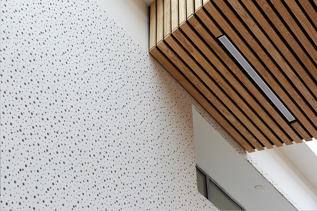 Holes in the wall, designed to absorb sound