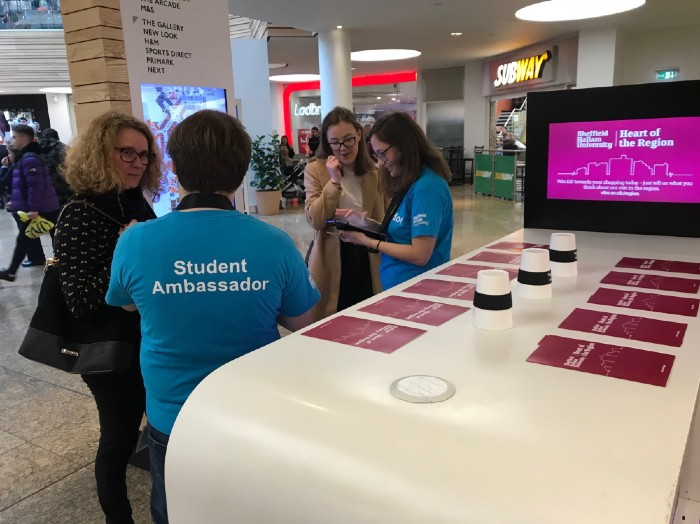 Student ambassadors completing our survey with members of the public
