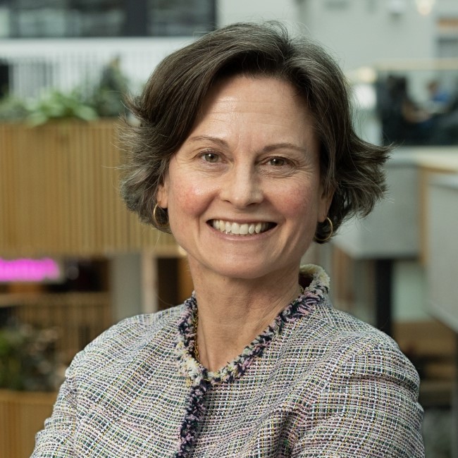 Image shows Jen Smith Maguire smiling at the camera