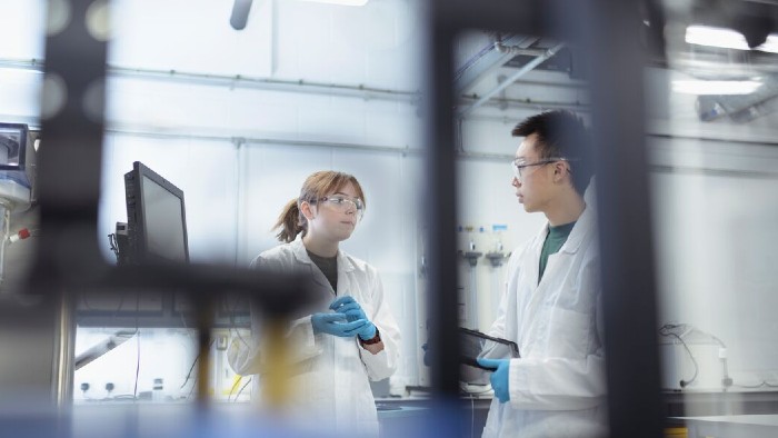 Two students in discussion in a laboratory