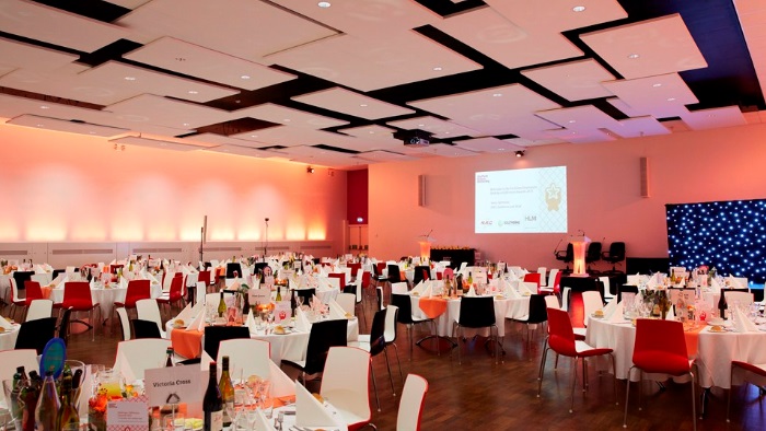 A formal tables and chairs layout in a hall