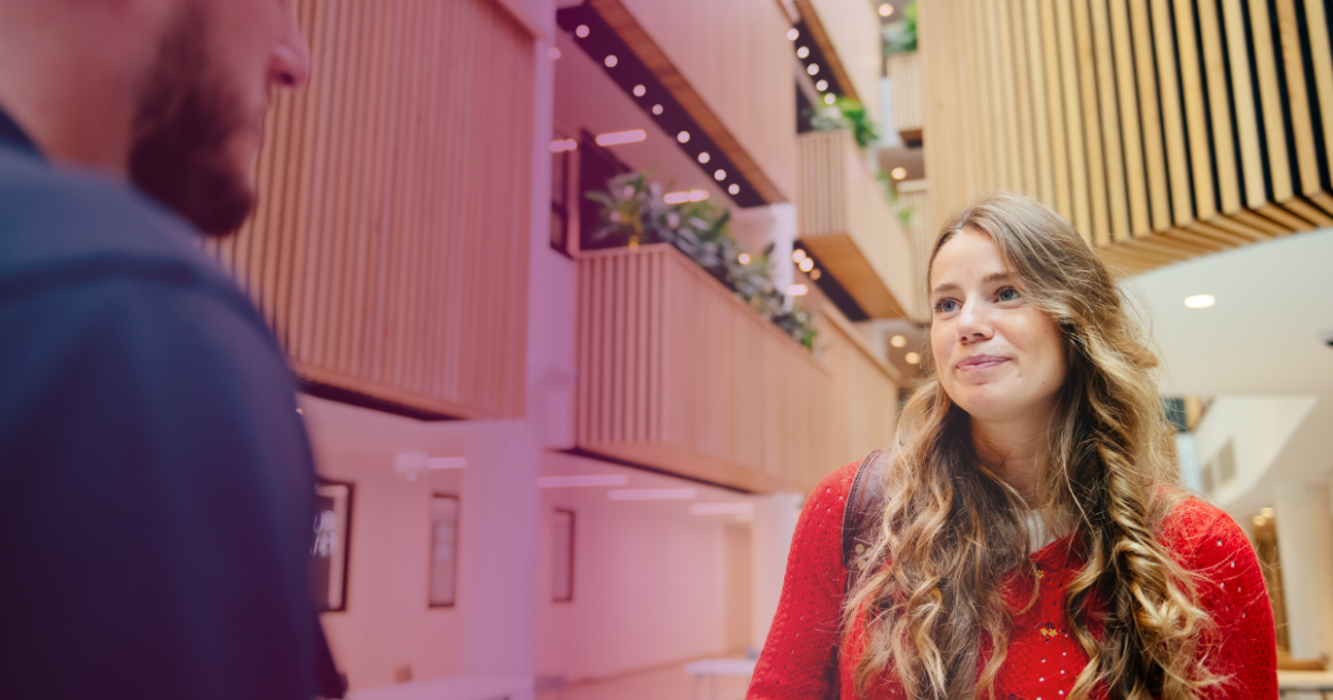 People talking at an event in Owen Building
