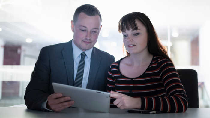 Two people reviewing a CV