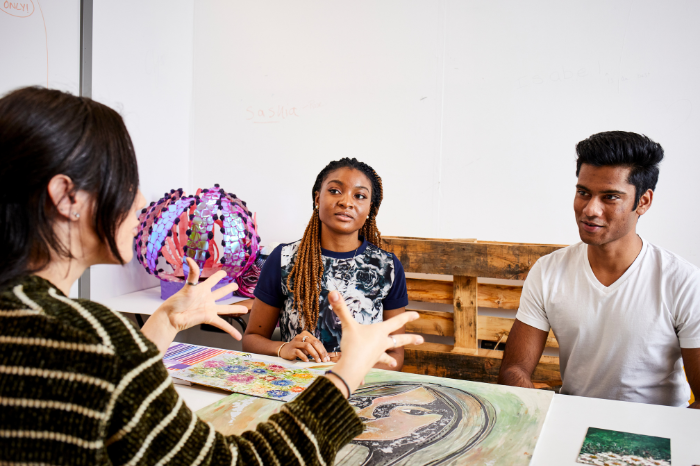 Group of people listening to educator