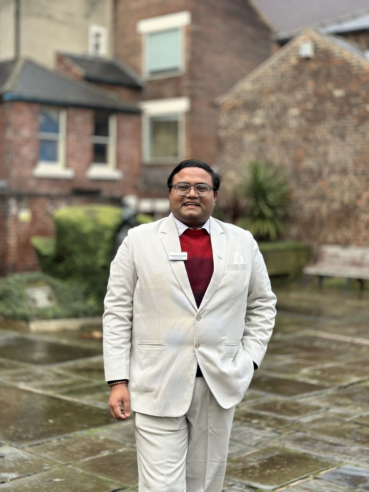 Graduate in suit outside