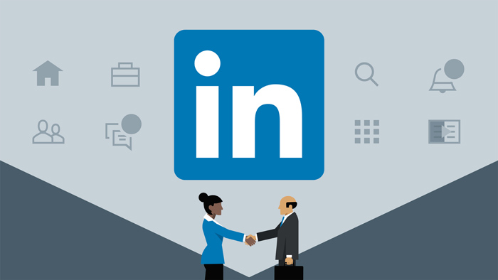 LinkedIn Learning logo and two business people shaking hands