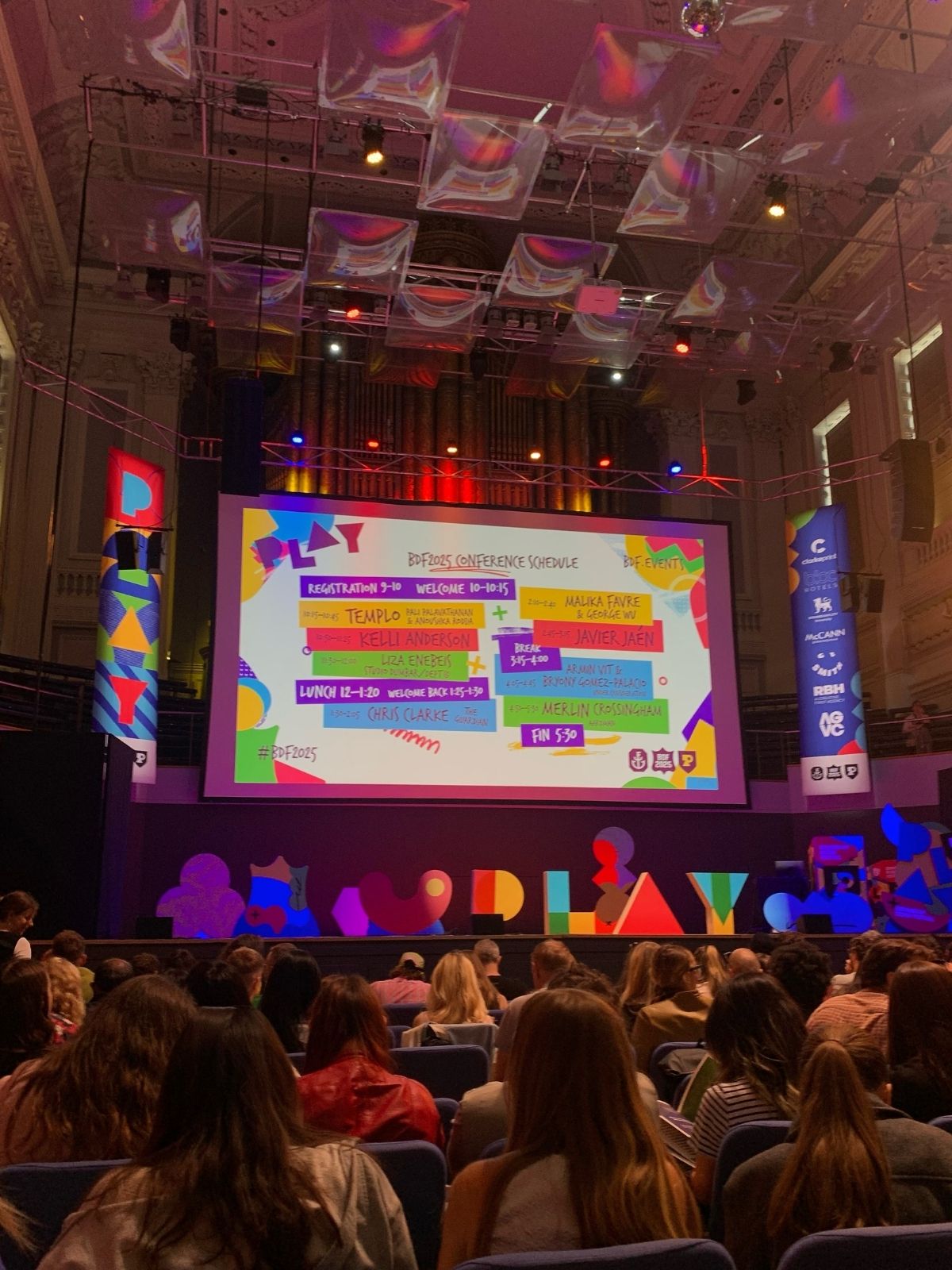 Crowd in front of a digital display