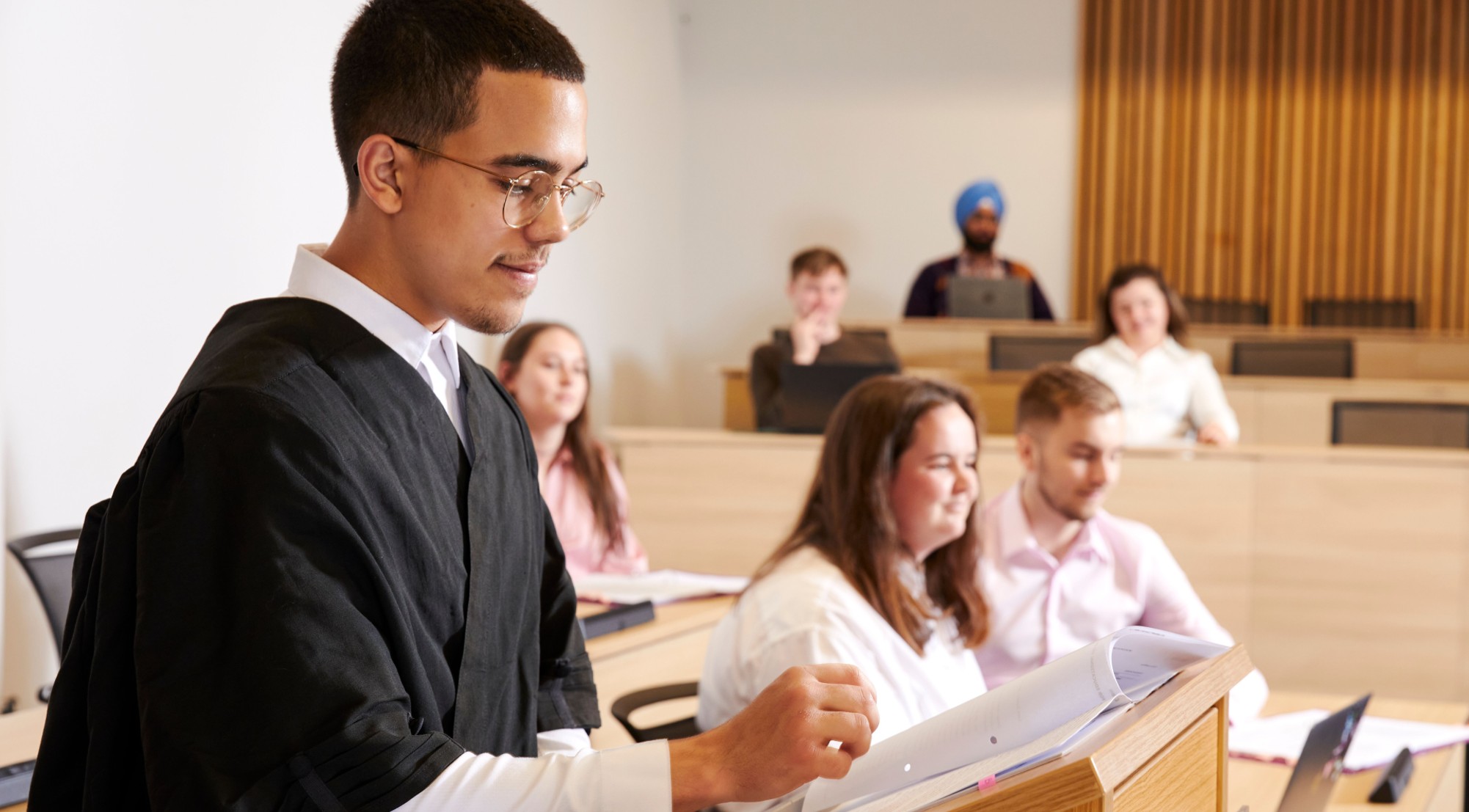 Student practising arguing a case in Sheffield Hallam's moot court.