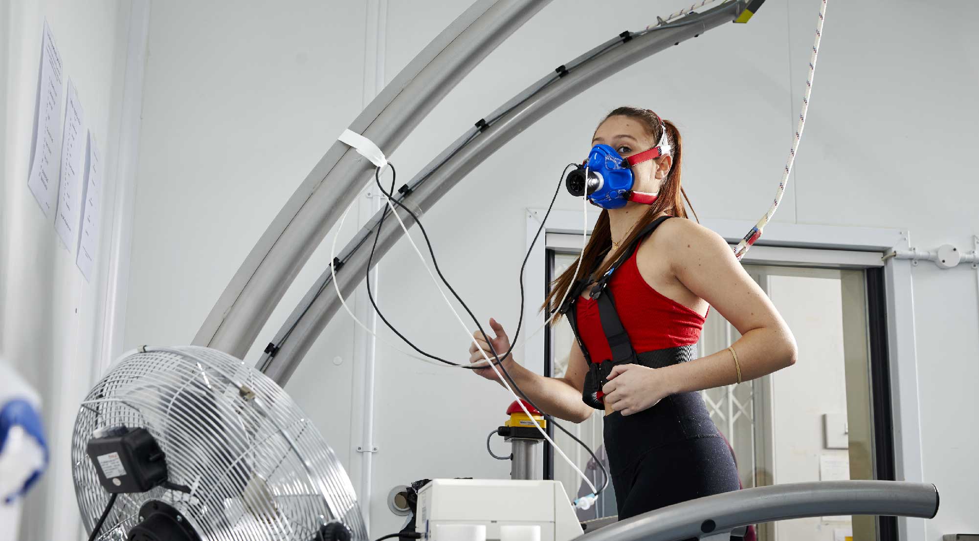A women exercising with performance tracking equipment
