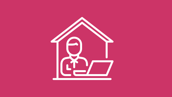 An icon depicting a person at home using a laptop