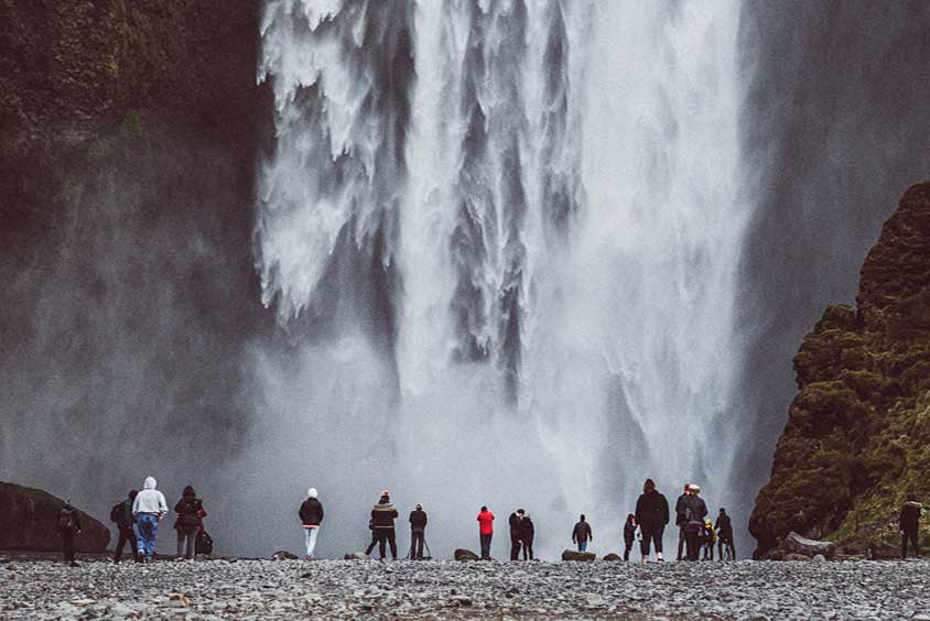 Students studying waterfall in Iceland