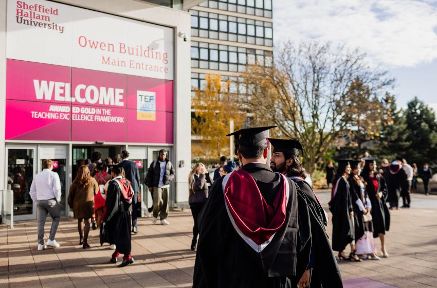 Students on graduation day outside Sheffield Hallam Owen Building