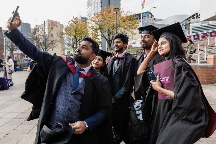 Sheffield Hallam graduates taking a selfie in Hallam Square