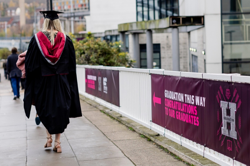 Graduate walking to Sheffield Hallam graduation 