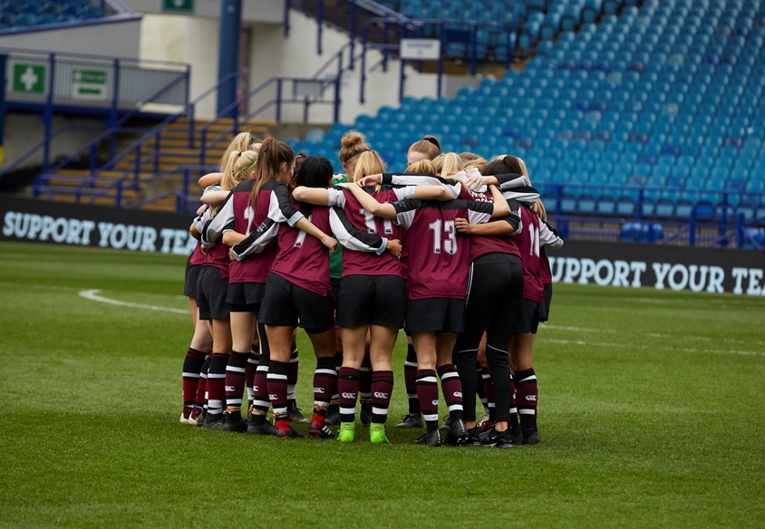 Womens Football team huddle at Hillsborough 
