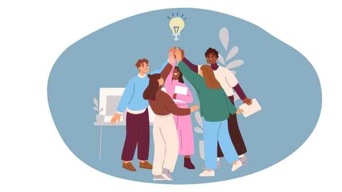 group of people stood together all holding a lightbulb aloft as a symbol of an idea