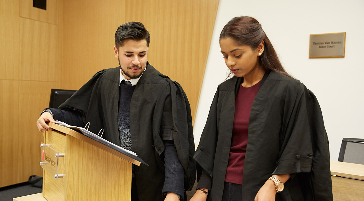 Two students in the moot court