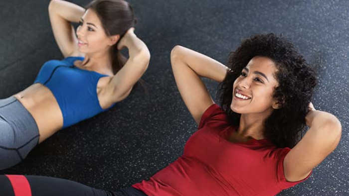 Two women enjoying a core fitness class