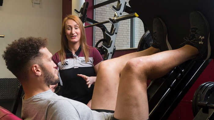 A personal trainer providing tuition
