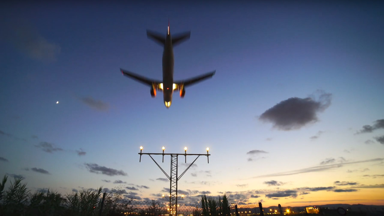 A video still of an aeroplane landing at night