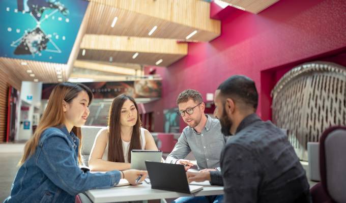 Students studying in an open space on campus