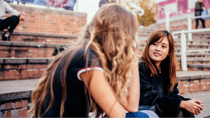 Two friends sat talking