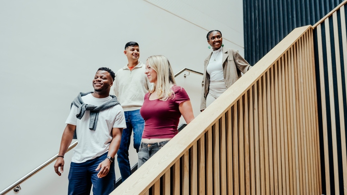 Group of students walking down a staircase