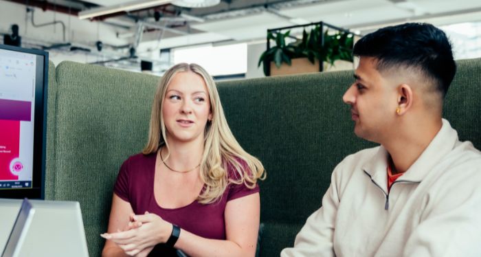 Two people talking at Sheffield Hallam University