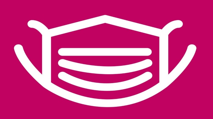 White mask on a pink background