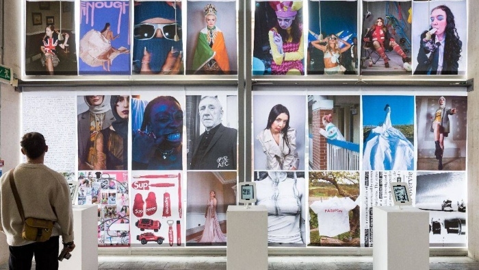 Student looking at a photography exhibit