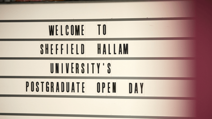 Lightbox sign reading "Welcome to Sheffield Hallam University's postgraduate open day"