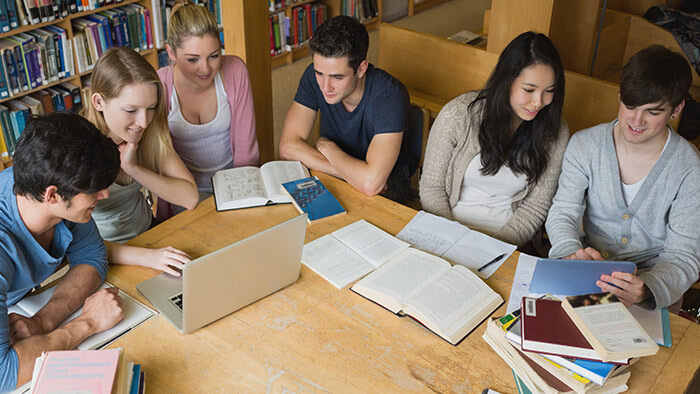 Six students sat around a table 