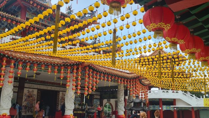 Chinese lanterns hanging across a pathway