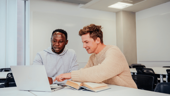 Two students collaborating in a classroom