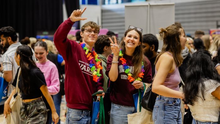 Two students enjoying a welcome week fair