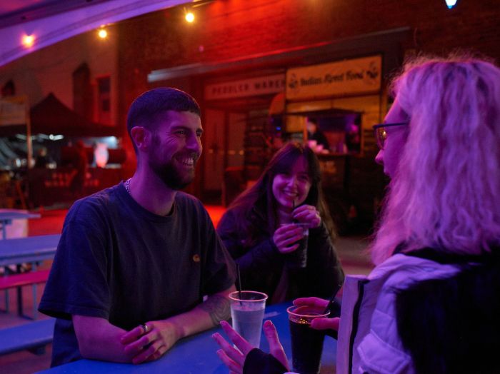 Three students at a bar