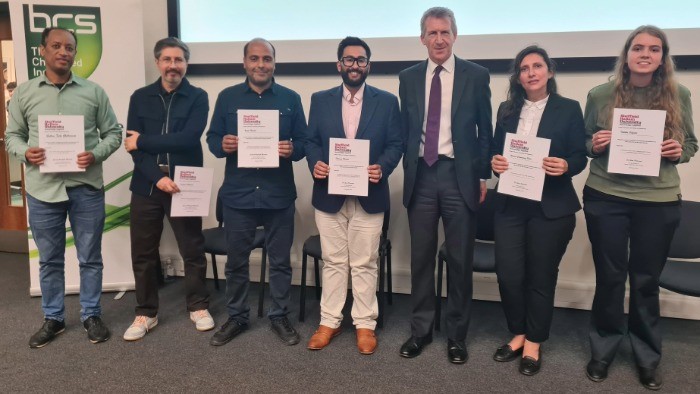 Minister Dan Jarvis stood with a group of students who are holding certificates