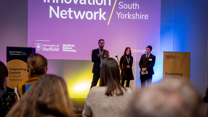 Three people on stage at the launch of the Innovation Network at the Millennium Gallery