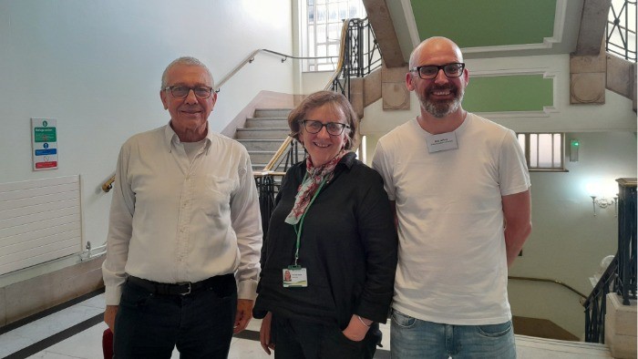 Prof David Hetherington, Councillor Ruth Hayes and Dr Bob Jeffery stand together in a line in the Islington council building. 