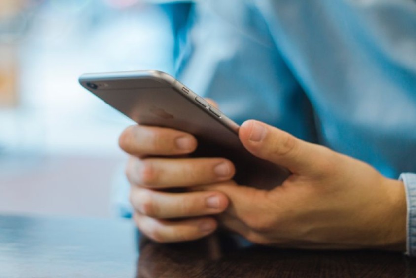 Someone holding a smartphone with both hands