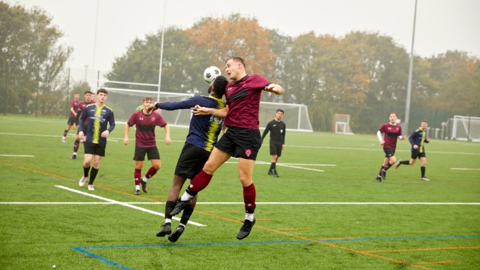 Football teams playing a match at Sheffield Hallam University pitches.