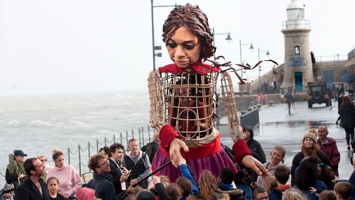 Little Amal, a 3.5 metre puppet of a 10-year-old refugee girl. 