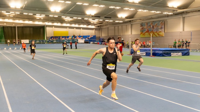 Rian Snell runs down an indoor athletics track, competing at the 2026 British Transplant Games in Sheffield.