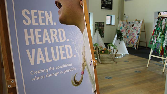 A sign for the Seen. Heard. Valued. exhibition at Sheffield Hallam University