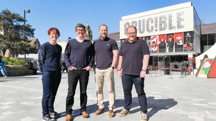 The four members of the research team stood in front of the Crucible Theatre in Sheffield.