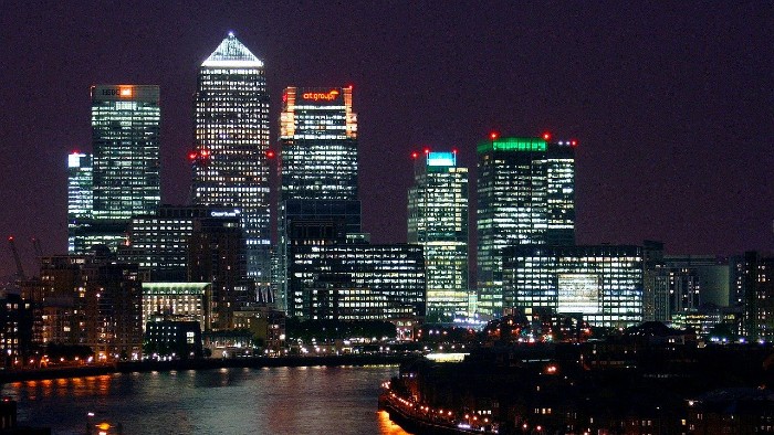A night time shot of skyscrapers in a city